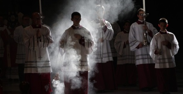 Altar boys arrive in procession during a mass celebrated by Pope Benedict XVI to commemorate cardinals and bishops who died this year, at the Vatican